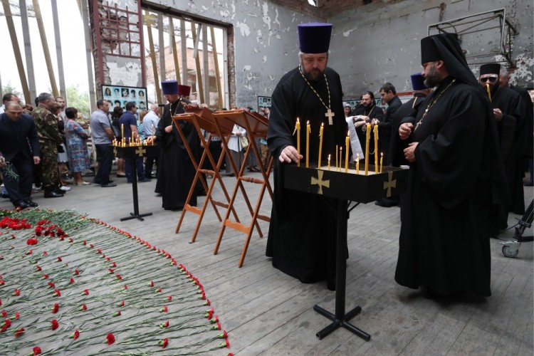 BESLAN, RUSSIA - SEPTEMBER 1, 2017: Priests attend an event in memory of the victims of the 2004 Beslan school siege in the gym of School No 1. On September 1, 2004, a group of Chechen militants took more than 1,200 people hostage; the hostage crisis lasted for 3 days, leaving 334 people dead, including 186 children. Sergei Savostyanov/TASS