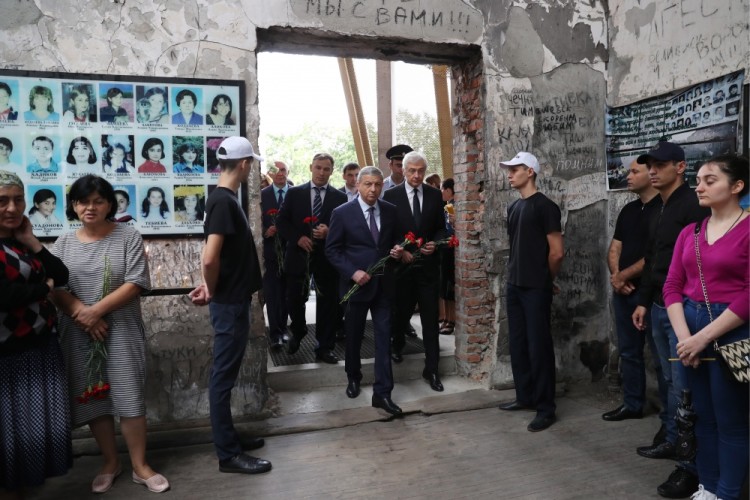BESLAN, RUSSIA - SEPTEMBER 1, 2017: Vyacheslav Bitarov (C), head of the Republic of North Ossetia-Alania, attends an event in memory of the victims of the 2004 Beslan school siege in the gym of School No 1. On September 1, 2004, a group of Chechen militants took more than 1,200 people hostage; the hostage crisis lasted for 3 days, leaving 334 people dead, including 186 children. Sergei Savostyanov/TASS