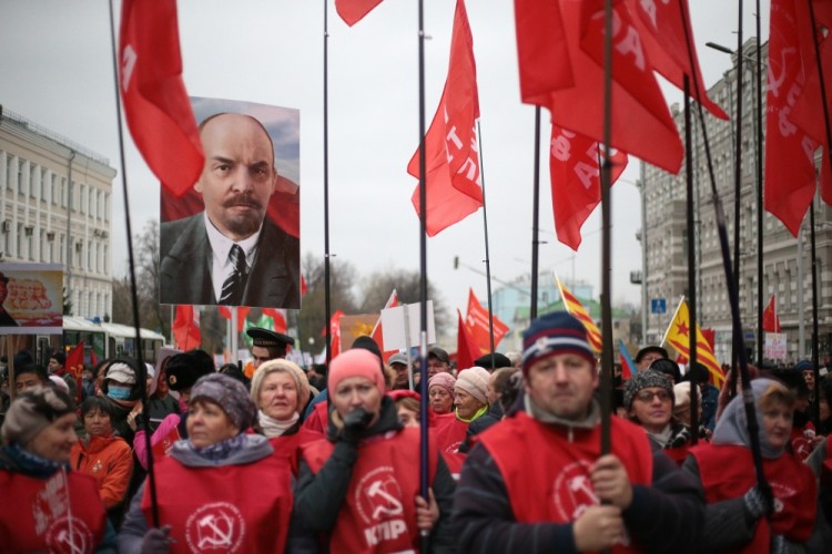 MOSCOW, RUSSIA  NOVEMBER 7, 2017: People carry red flags and a portrait of Russian revolutionary Vladimir Lenin as the Russian Communist Party rallies to mark the centenary of the 1917 Bolshevik Revolution. Sergei Bobylev/TASS