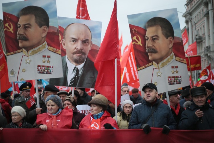 MOSCOW, RUSSIA  NOVEMBER 7, 2017: People carry portraits of Russian revolutionary Vladimir Lenin and Soviet leader Joseph Stalin as the Russian Communist Party rallies to mark the centenary of the 1917 Bolshevik Revolution. Valery Sharifulin/TASS