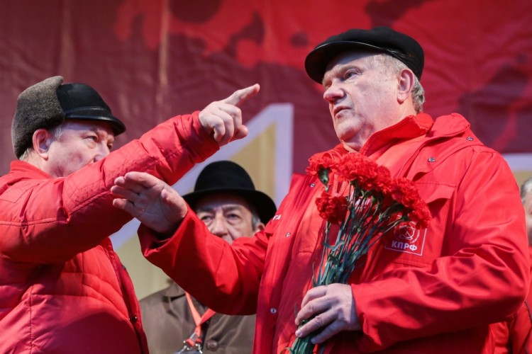 MOSCOW, RUSSIA  NOVEMBER 7, 2017: Russian Communist Party leader Gennady Zyuganov (R) takes part in a rally to mark the centenary of the 1917 Bolshevik Revolution. Sergei Bobylev/TASS