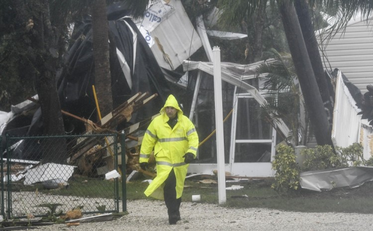 Sep 10, 2017; Palm Bay, FL, USA;  Firefighters examine damage to six homes in the Palm Bay Estates mobile home park. The tornado was spawned by Hurricane Irma. Mandatory Credit: Craig Bailey/Florida Today via USA TODAY NETWORK