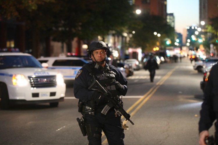 (171031) -- NEW YORK, Oct. 31, 2017 (Xinhua) -- A police officer stands guard near the site of an attack in lower Manhattan in New York, the United States, on Oct. 31, 2017. Eight people were killed and a dozen more injured after a truck plowed into pedestrians near the World Trade Center in New York City, the mayor said on Tuesday. (Xinhua/Wang Ying) (Photo by Xinhua/Sipa USA)